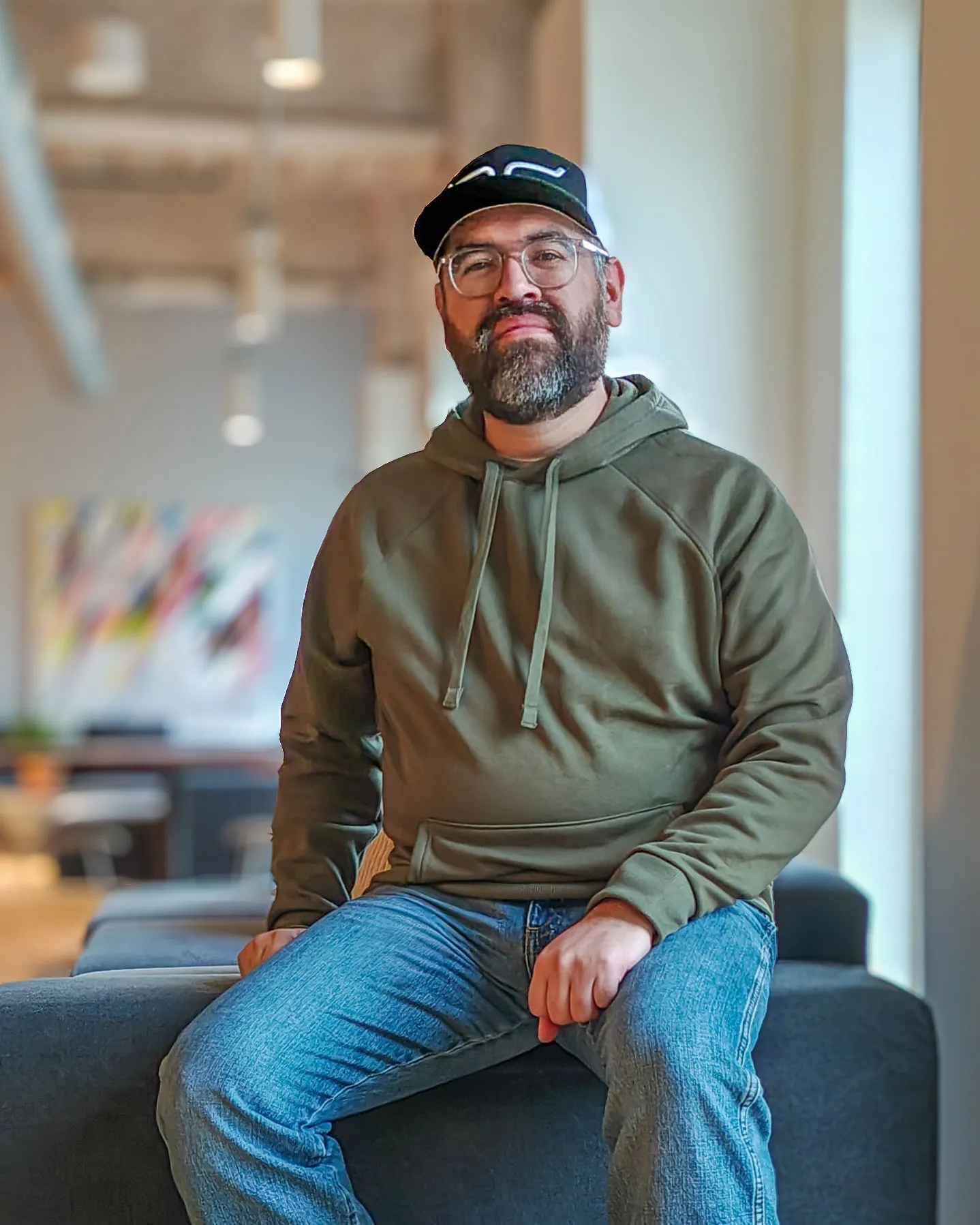 Luis Acoltzi, founder of Pixel Hangar, seated in his studio.
